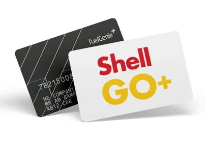 Shell GO+ card: A white card with the Shell logo on it. It has a chip for contactless payments and offers rewards for fuel purchases. In front of a black fuelGenie plus card.