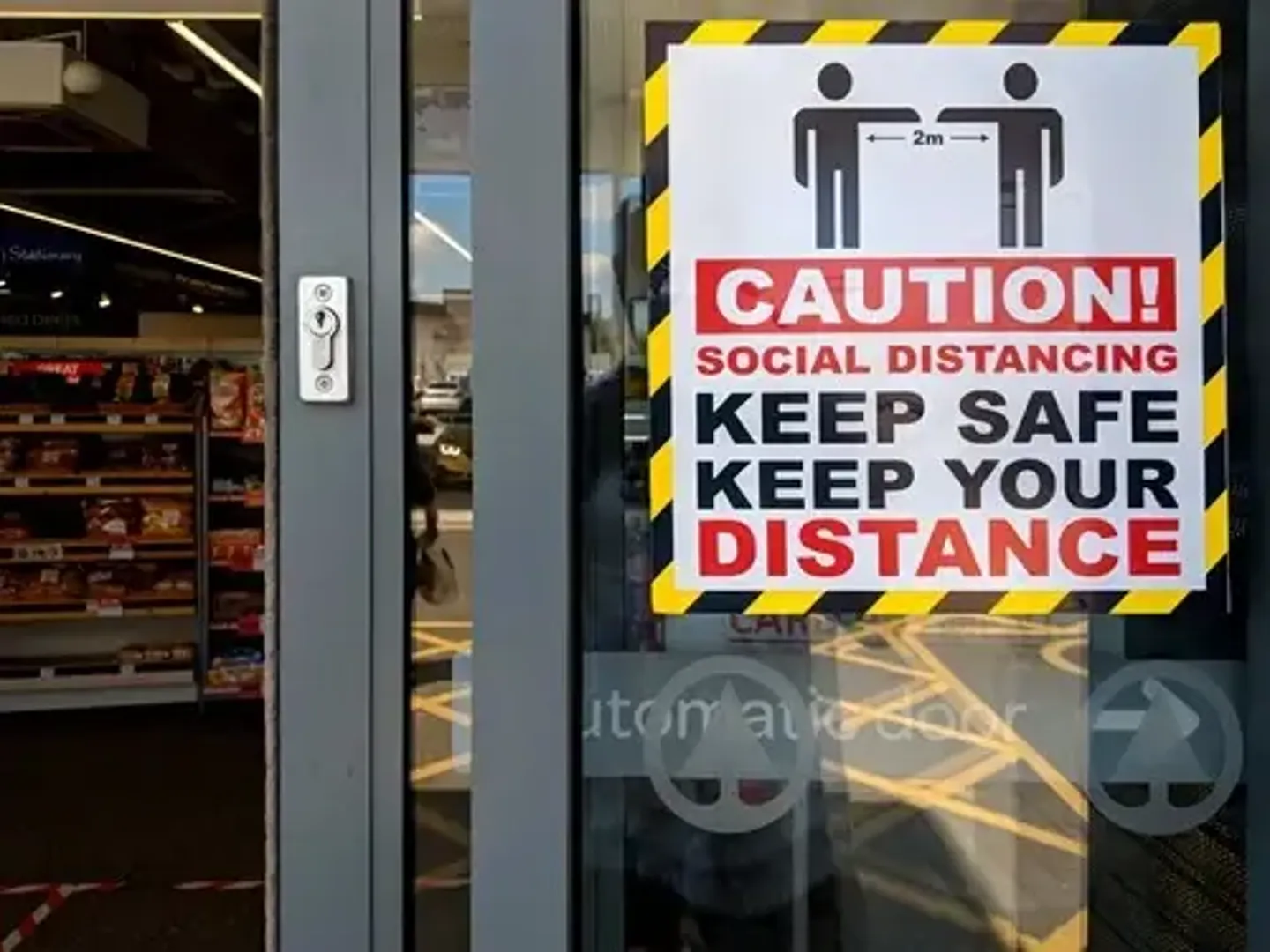 Sign on door of business about social distancing