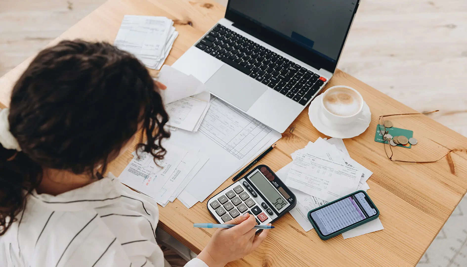 Woman working out finances with calculator