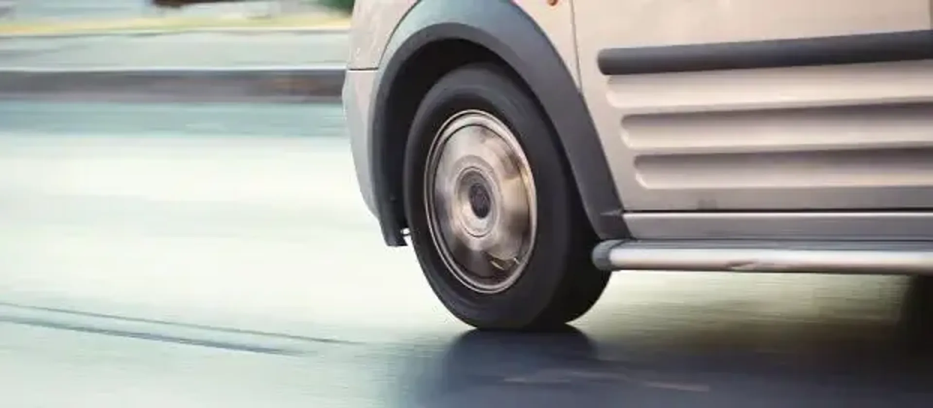 Close up of van's wheels on road