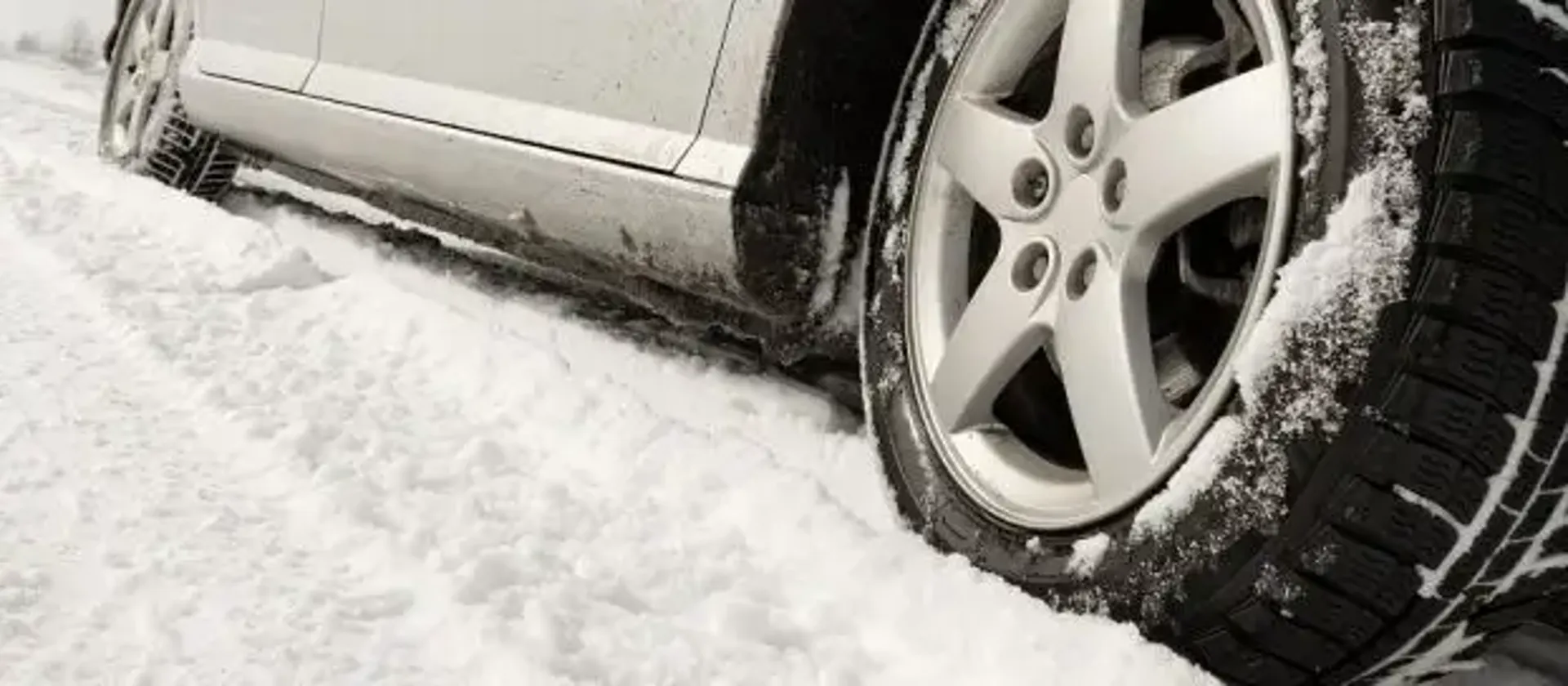 rear car wheel in the snow.