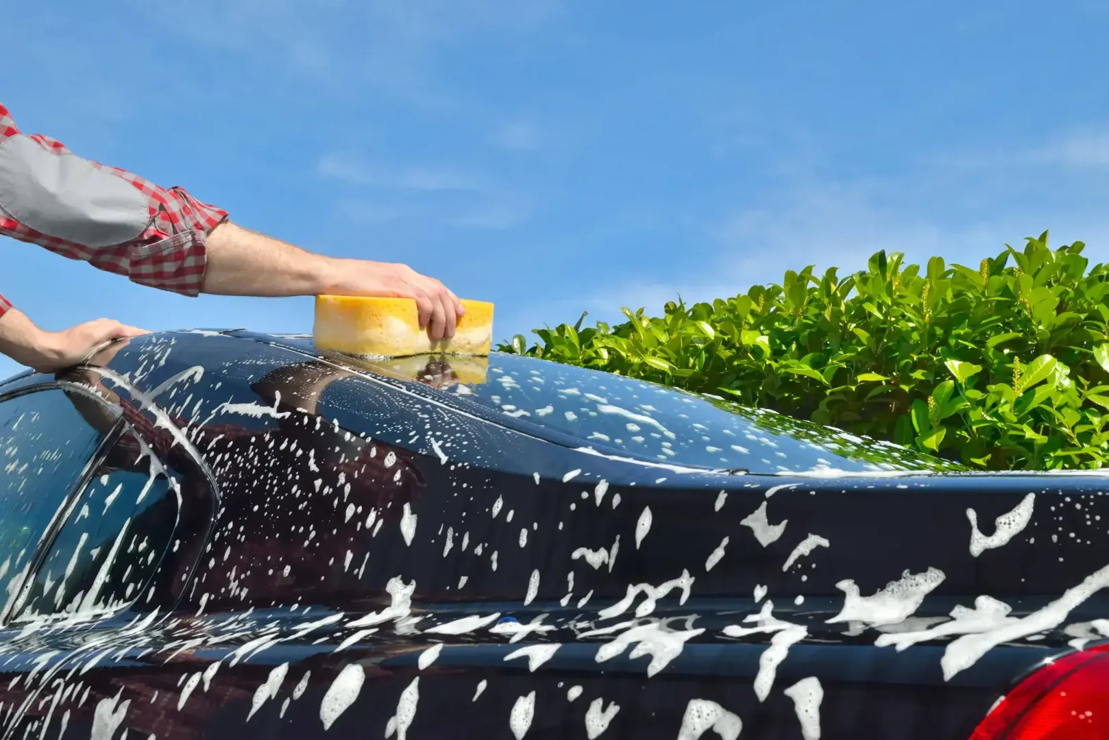 Car being washed on a sunny day