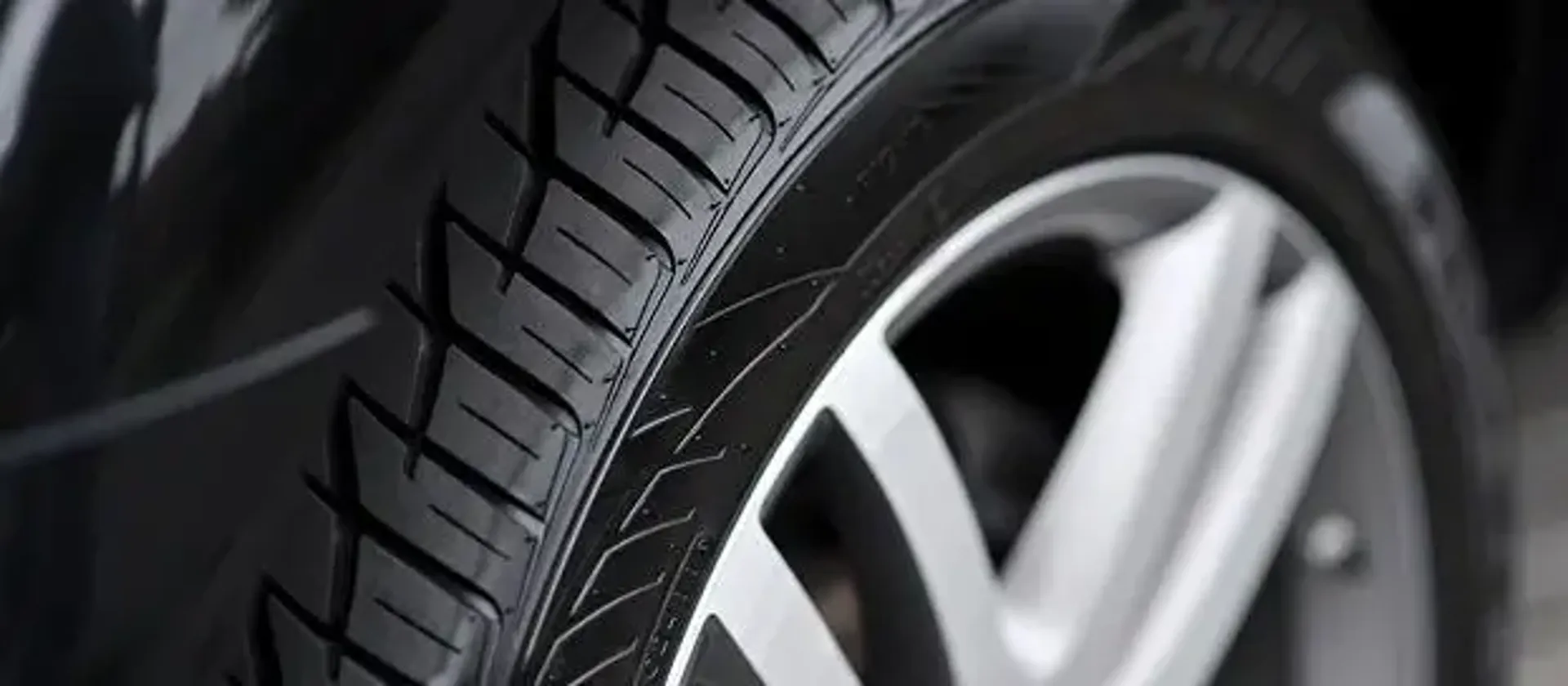 Close-up of car tire tread pattern. Provides excellent traction on various road surfaces.