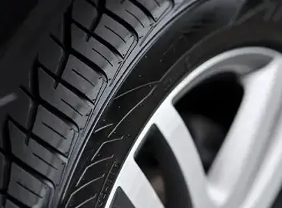 Close-up of car tire tread pattern. Provides excellent traction on various road surfaces.