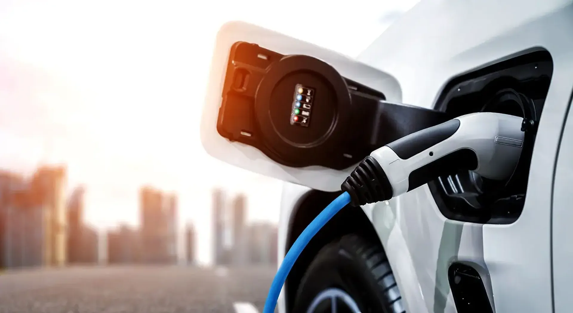 An electric car plugged into a charger, ready to charge its battery and reduce carbon emissions.